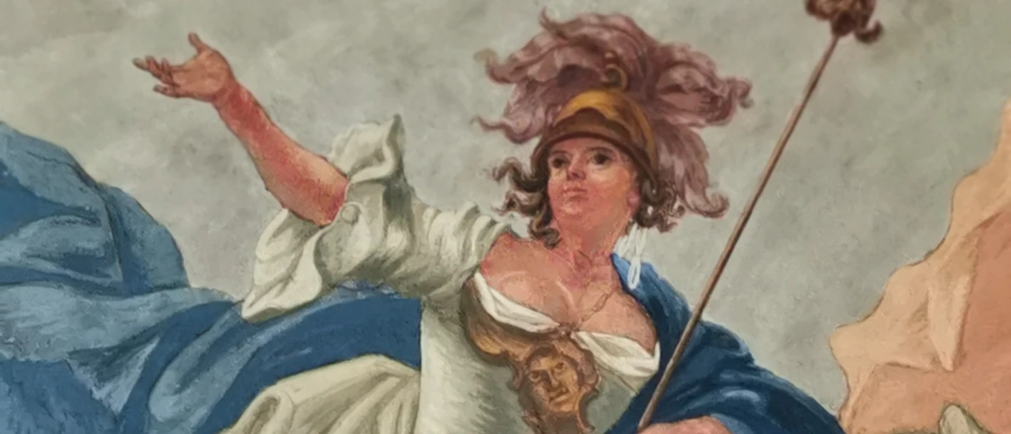 Moneta.jpg Frau in historischer Kleidung mit Kopfbedeckung, Zepter und einem Gesichtsmotiv im Vordergrund.