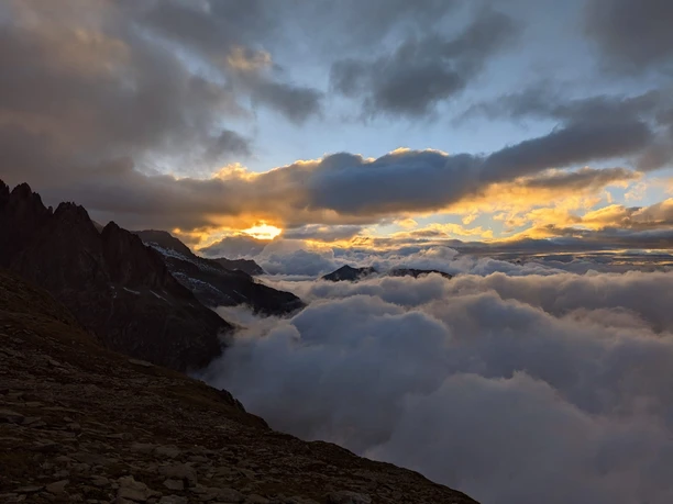 Sunrise over the sea of clouds Night hike Bettmeralp Belalp with spectacular sunrise over a dense sea of clouds in the Aletsch Arena