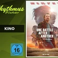 filmplakat-onebattleafteranother.jpg Filmplakat „One Battle After Another“ mit Darstellern vor Sonnenuntergang und FSK 16-Hinweis.