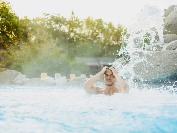 Kurhessen Therme in Kassel A gentleman bathes in an outdoor pool at the Kurhessen Therme.