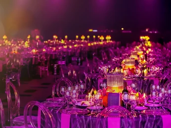 CTI - Compass Tours Incoming - Banquett Tables set with festive lighting in atmospheric light.