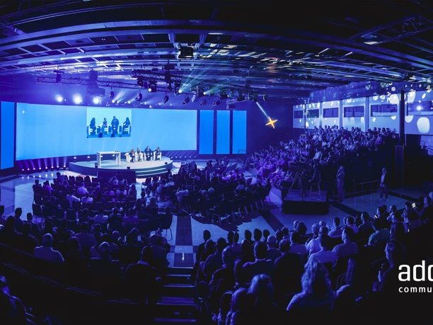 add on communication GmbH - Conference room Conference hall with audience and stage.