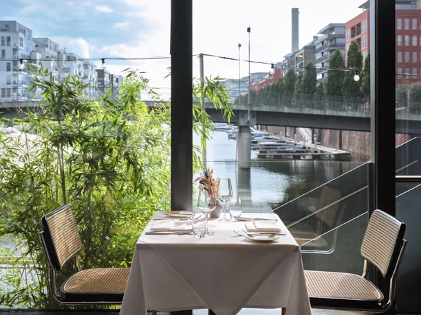 Frankfurter Botschaft - River View Set table by the window with river view.