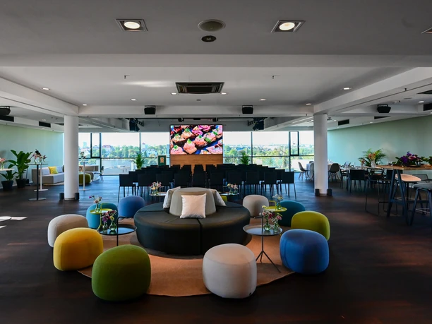Upper East Site - Event room Event room with colorful stools and rows of chairs
