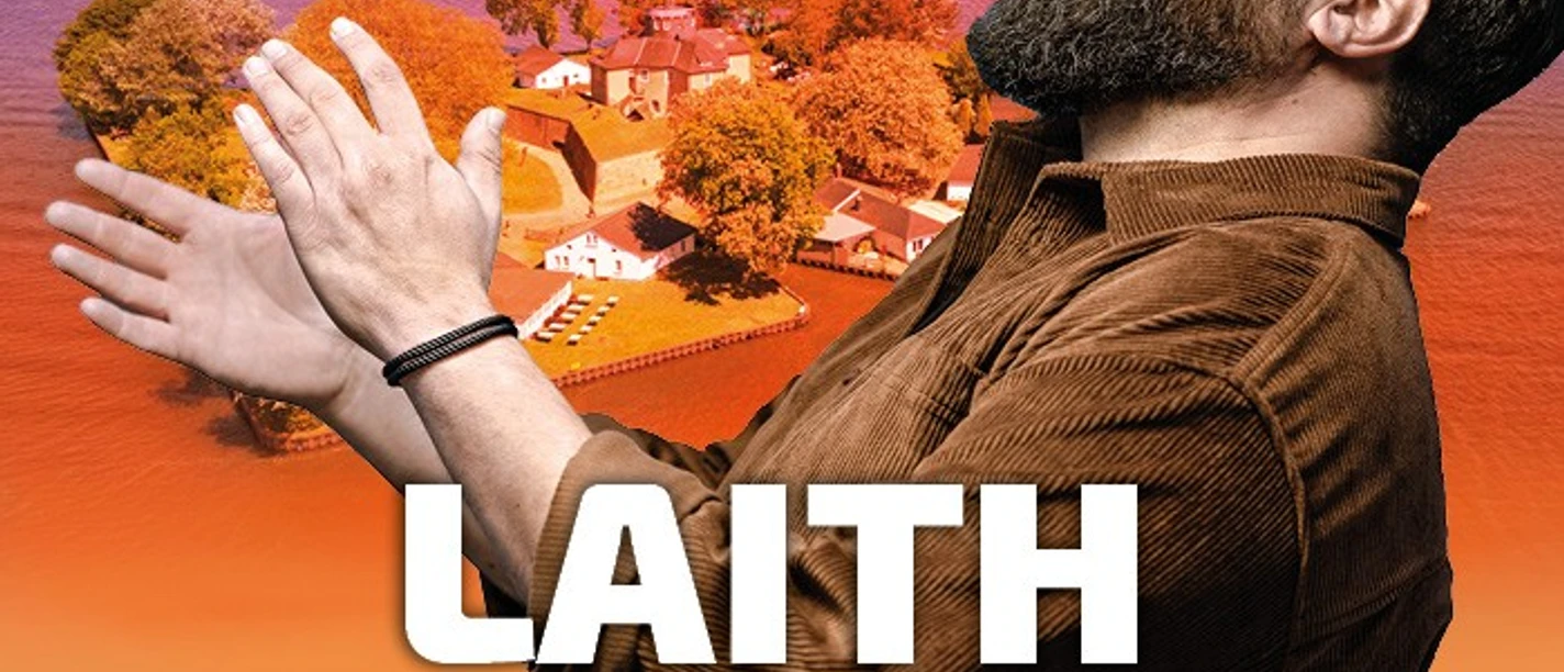 LAITH-AL-DEEN.jpg Laith Al-Deen laughs with outstretched arms in front of the sunset over the island of Wilhelmstein.