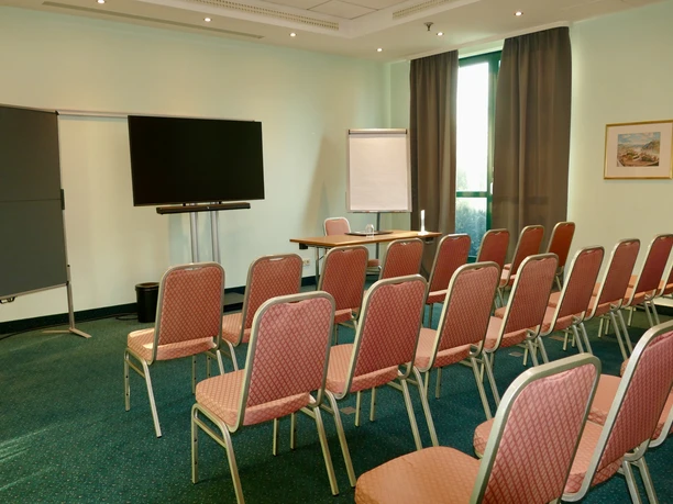 Hotel Amadeus Frankfurt - Conference row seating Conference room with row seating and a view of a presentation area.