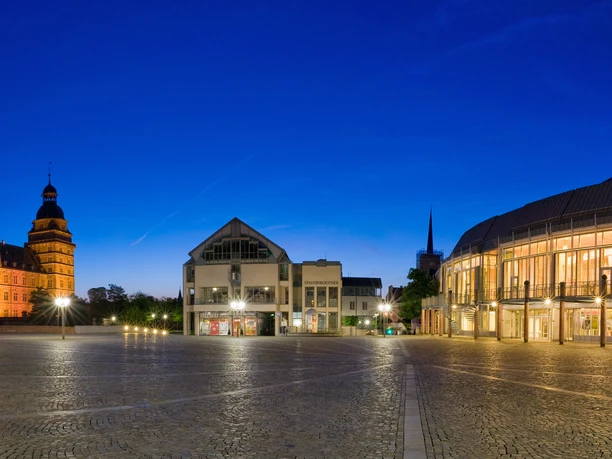 Aschaffenburg Town Hall Illuminated square with castle and town hall at night.