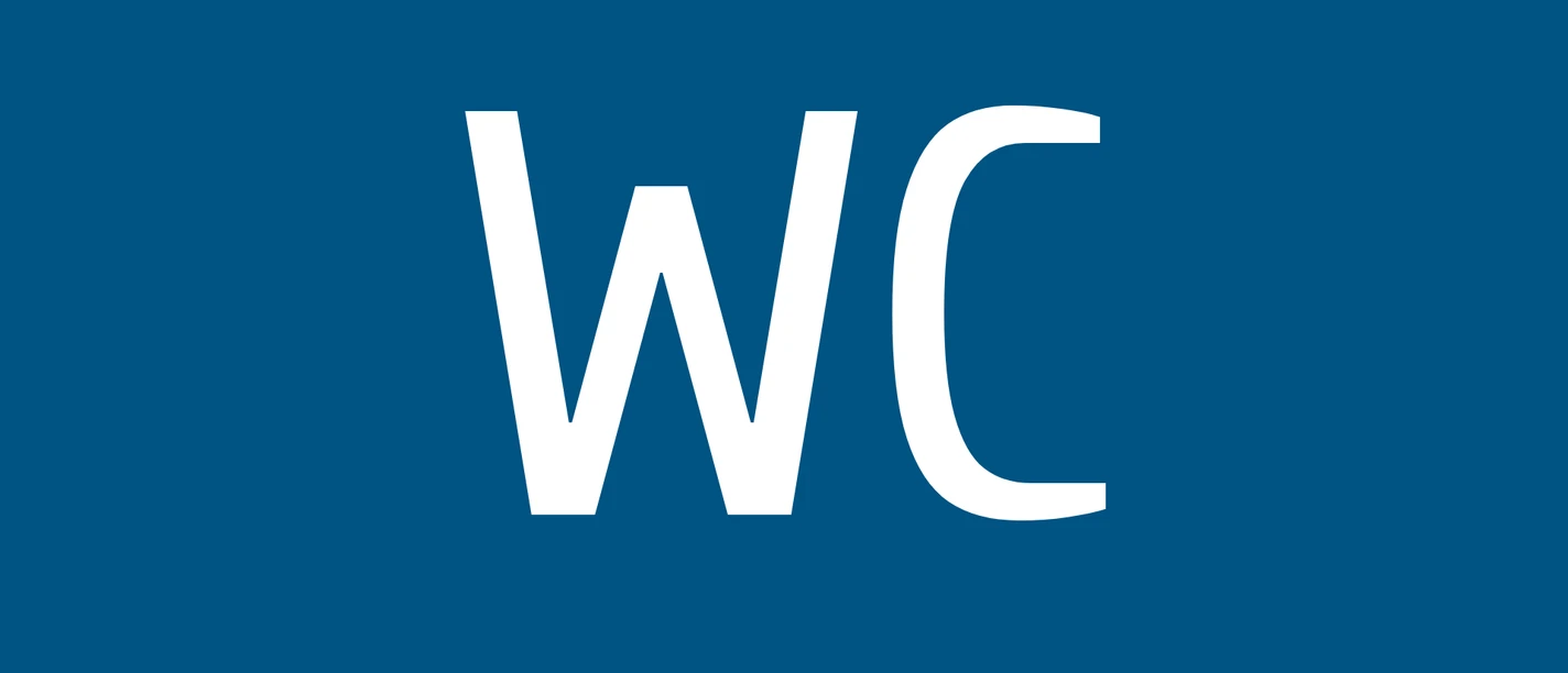 WC Weißes WC-Symbol auf blauem Hintergrund als Hinweisschild für eine öffentliche Toilette.