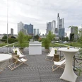 Museum of Communication Frankfurt - Roof terrace Roof terrace with bar tables and skyline view.