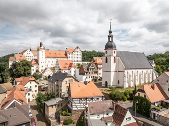 Stadtkirche St. Egidien - Churches in the Leipzig region View of the old town of Colditz with the town church and the striking Colditz Castle in the background.