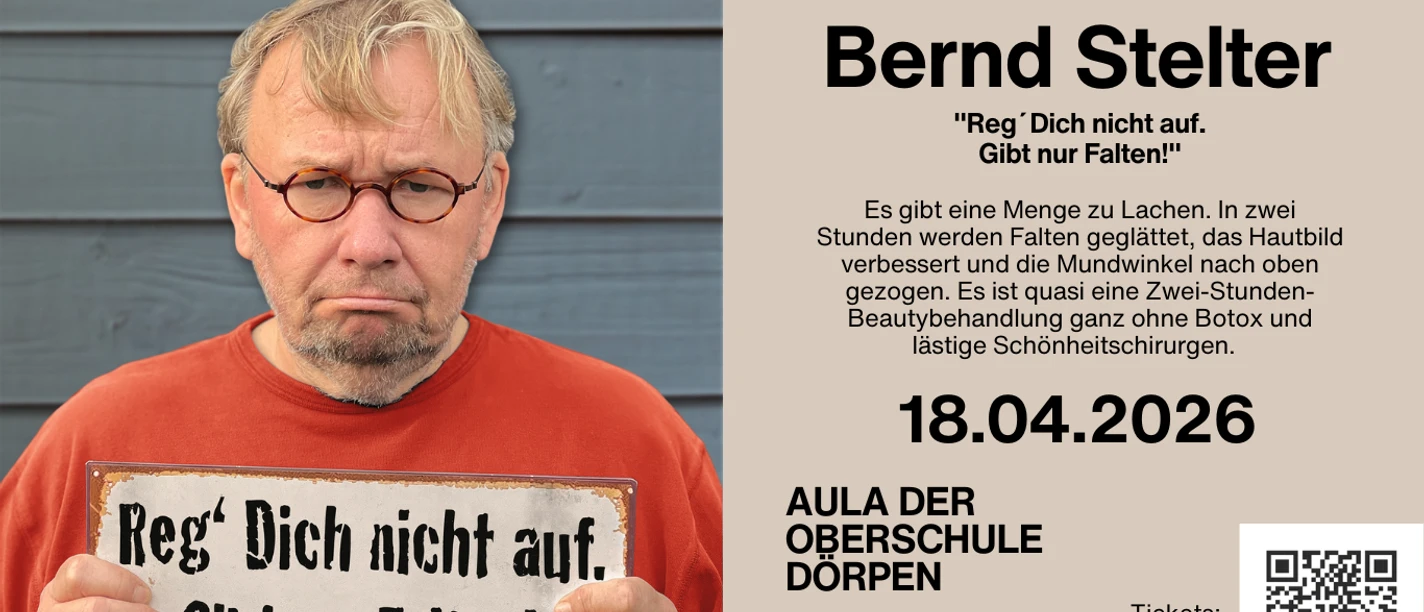 Bernd Stelter.png Ein Mann mit rotem Pullover und rundem Brillengestell hält ein Schild mit humorvollem Spruch.