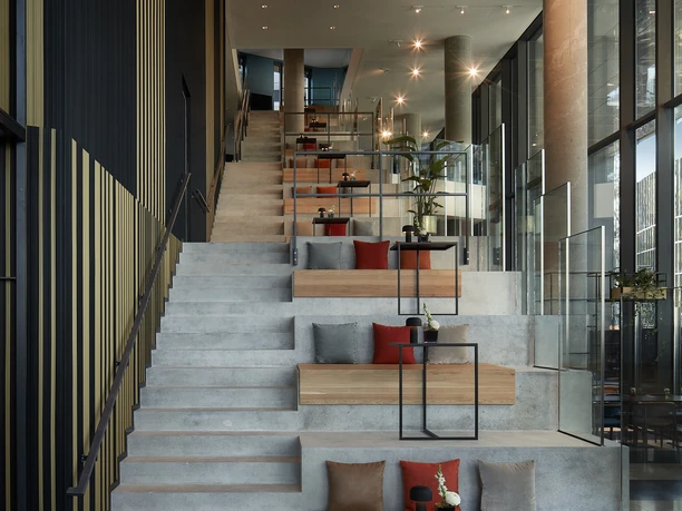 NH Collection Frankfurt Spin Tower - Staircase Staircase with inviting seating niches along the steps.