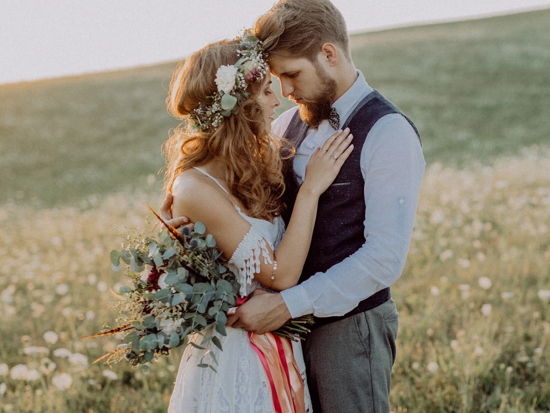 Beautiful bride and groom at sunset in green nature. Beautiful bride and groom at sunset in green nature.