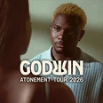 Ein junger Mann mit blondem Haar schaut fokussiert und nachdenklich in die Kamera. Der Text "Godwin Atonement Tour 2026" ist präsent.