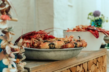 WISAG Event Service GmbH & Co. KG - Lobster platter A bowl of lobster, decorated on a sideboard.