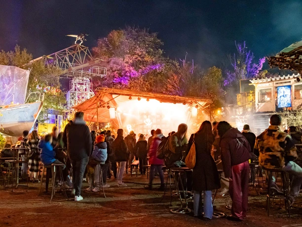 Hustle and bustle at a night-time open-air event in Odonien.
