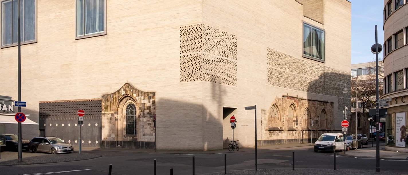 Museum building in Cologne with minimalist architecture and large windows.