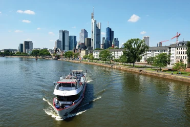 Köln-Düsseldorfer Deutsche Rheinschiffahrt GmbH - Ship on the Main in front of the skyline. Köln-Düsseldorfer: Ship on the Main in front of the skyline.