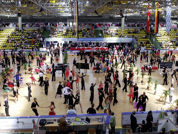 Eissporthalle Frankfurt - Interior view with dancing couples Interior view with dancing couples Large hall with parquet floor and numerous couples at a dance tournament.