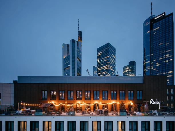 Ruby Louise Hotel Frankfurt - Exterior view Exterior view of hotel with illuminated roof terrace at night