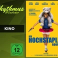 filmplakat-derhochstaplerroofman.jpg Mann mit großem Plüschtier auf den Schultern, rosa Schwimmring und Spielzeugpistole.