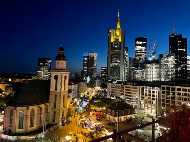 Location Rhein-Main - Skyline Frankfurt am Main at night. You can see the skyline with the Commerzbank Tower and the illuminated St. Catherine's Church on the Hauptwache.