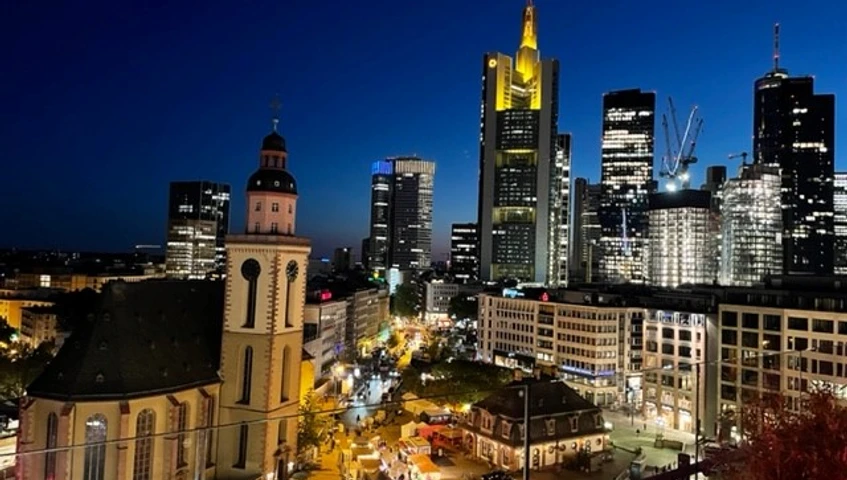 Location Rhein-Main - Skyline Frankfurt am Main at night. You can see the skyline with the Commerzbank Tower and the illuminated St. Catherine's Church on the Hauptwache.