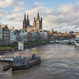 Rhine bank in Cologne Boats on the Rhine in front of Cologne's old town and striking skyline create a lively excursion atmosphere