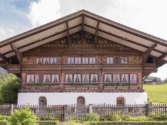 House Feld in Oey Impressive wooden chalet with elaborately carved and painted façade