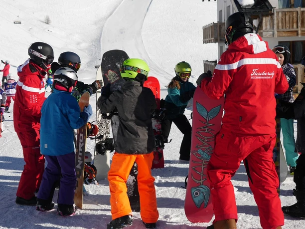 Learning first steps together Children receive instructions from ski instructors on the Fiescheralp snowboard taster course