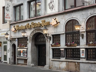 Brewery Em Kölsche Boor Historic brewery façade with dark windows, lanterns and flower boxes on Eigelstein in Cologne
