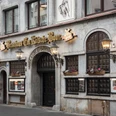 Brewery Em Kölsche Boor Historic brewery façade with dark windows, lanterns and flower boxes on Eigelstein in Cologne