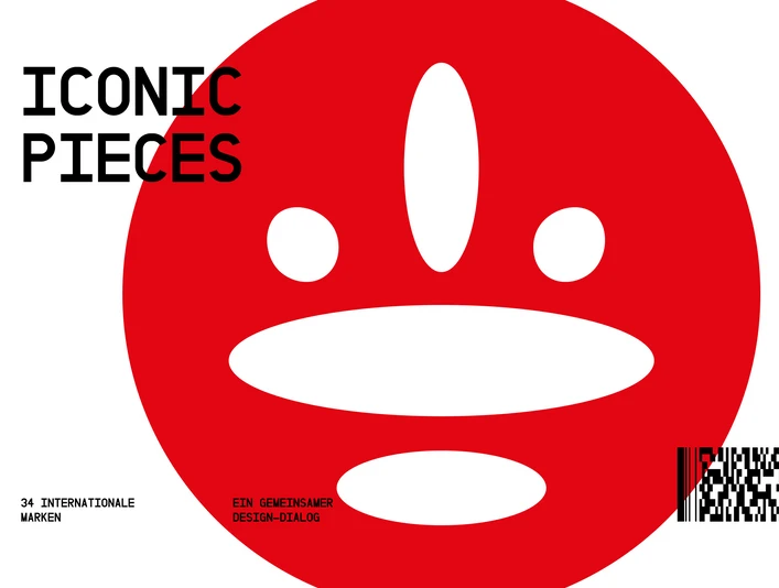 Designpost_Exhibition_Iconic_Pieces Rotes Grafikmotiv mit weißen ovalen Formen und schwarzem Schriftzug Iconic Pieces.Red graphic motif with white oval shapes and black Iconic Pieces lettering.