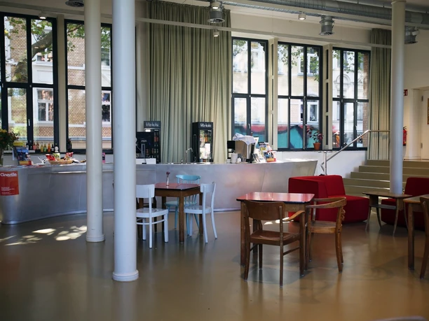 Filmhaus, Foyer A bright foyer with a large window front and columns.
