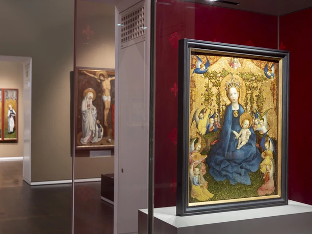 Wallraf-Richartz-Museum Exhibition room with medieval paintings, in the foreground a framed depiction of the Virgin Mary.