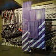 Intervention! How do we tell the history of National Socialism today? Exhibition room with historical propaganda photos and purple information boards