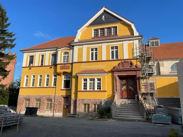 Theater Altes Hallenbad - Theater building Yellow "swimming pool" theater building with scaffolding.