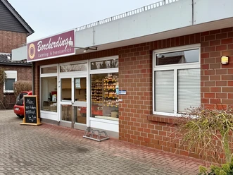 Borcherding Bruchhausen-Vilsen.jpg Außenansicht eines Hofladens mit rotem Backstein, Glasfront und Schild Borcherding Catering