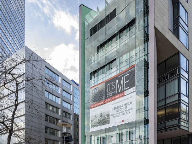 Dance Museum of the German Dance Archive Cologne Modern glass façade in the Mediapark with outdoor seating and banners of the Tanzmuseum
