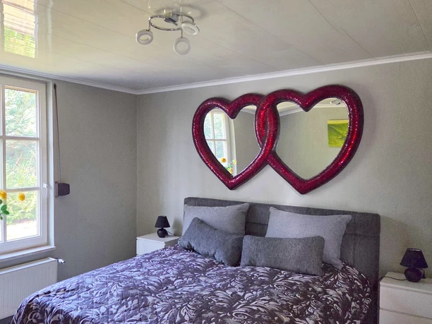 Herzliches Schlafzimmer im Ferienhaus Herzkate Herzliches Schlafzimmer im Ferienhaus Herzkate