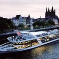 All-inclusive evening trip to Cologne Evening passage along the Rhine on a modern passenger ship against the backdrop of Cologne's historic old town