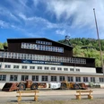 Ore processing at the Rammelsberg World Heritage Site Ore processing building at Rammelsberg with old mining vehicles in front of it.