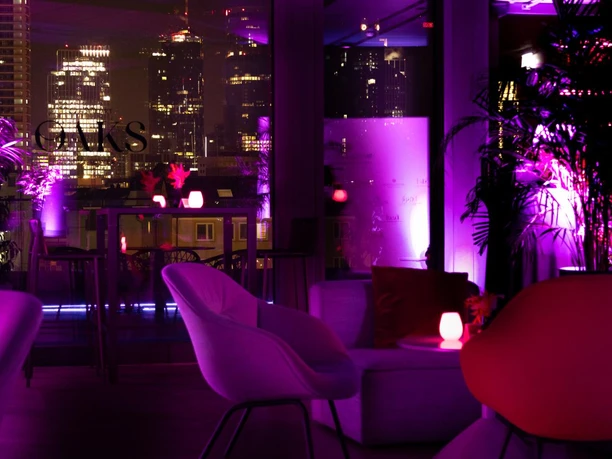 OAKS Bar in the NH Collection Frankfurt Spin - indoor area Oaks lounge with skyline view at night