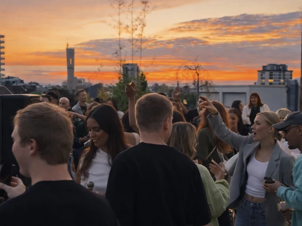 The Suite Garden Hotel - Roof terrace People dancing on rooftop terrace at sunset