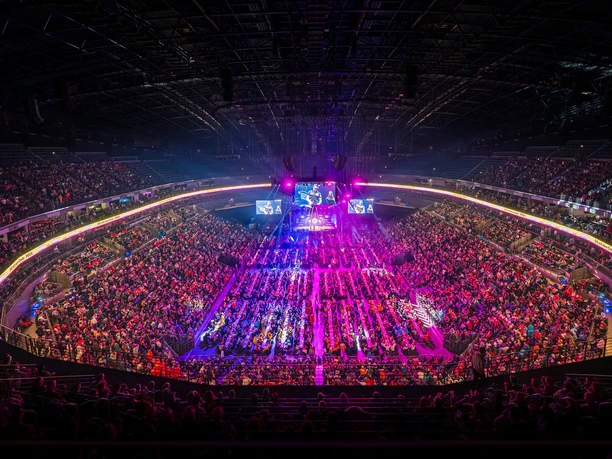 Winamax Cologne World Darts Gala View of a full arena with colorful lights and a central darts stage during an event