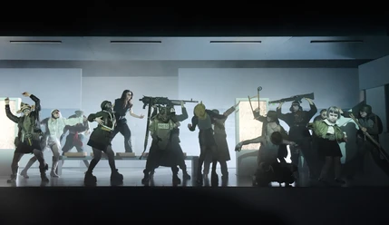 "Retribution" directed by Sebastian Baumgarten as a live radio play Ensemble in a gloomy stage fight scene with masks, fake weapons and dramatic lighting.
