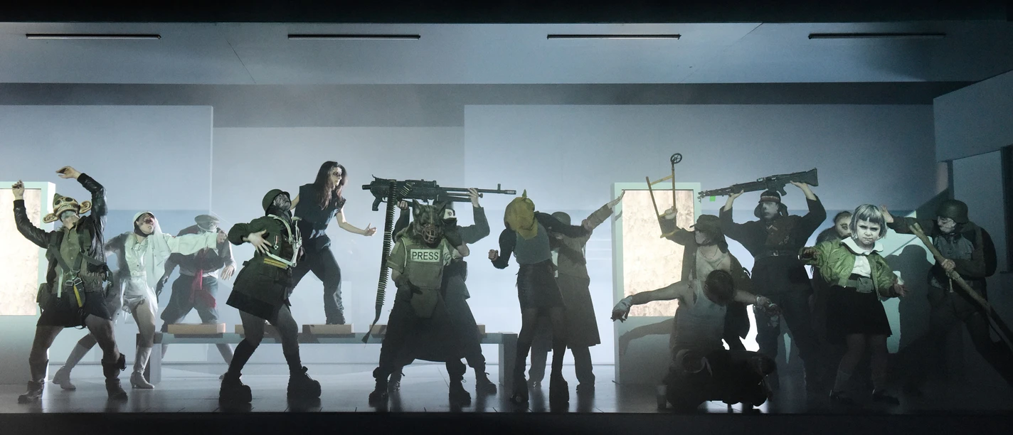 "Retribution" directed by Sebastian Baumgarten as a live radio play Ensemble in a gloomy stage fight scene with masks, fake weapons and dramatic lighting.