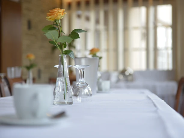 Festively laid table with a rose in the German House in Gifhorn