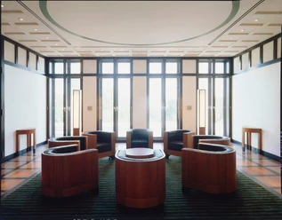 O.M. Ungers, Residence of the German Ambassador, Washington, D.C. 1987-1995 Bright room with black windows and six round wooden armchairs arranged symmetrically