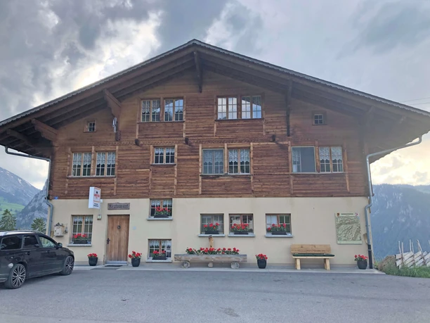 Restaurant Springenboden exterior view Facade of the restaurant building, red geraniums in front of the windows